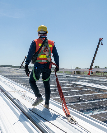 Photo of a Roofer on the Roof