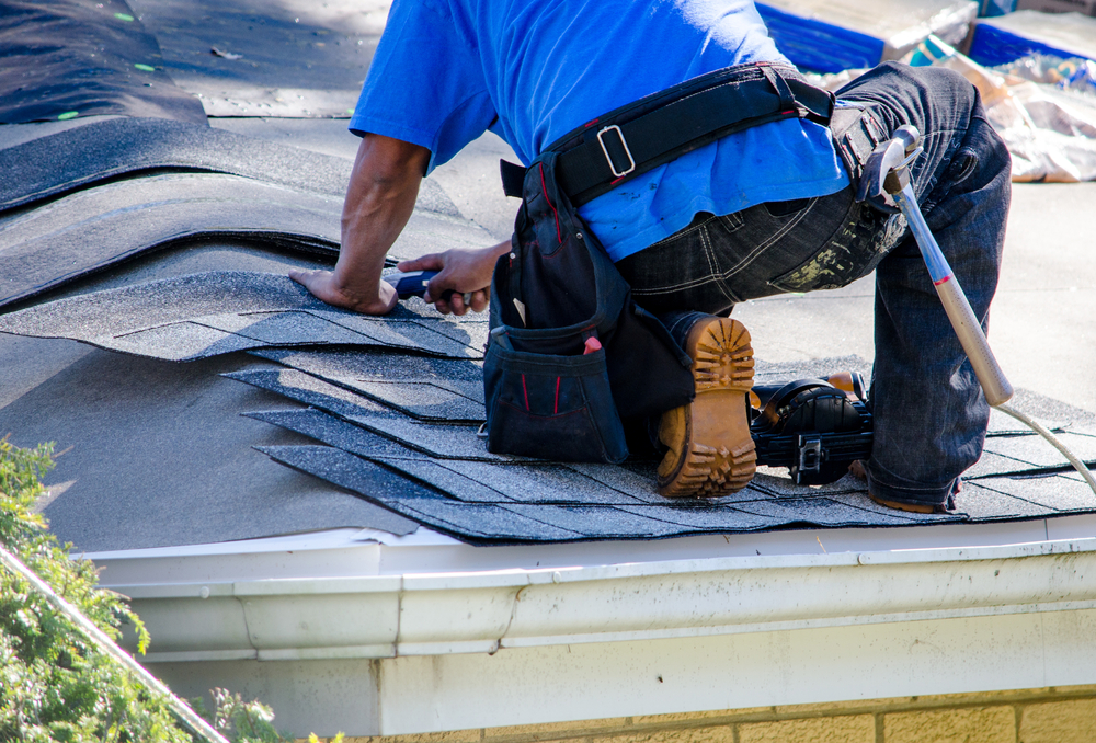 Person fixing roof