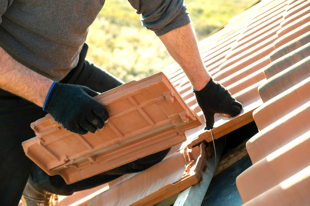 Photo of a Worker Installing Clay Roof